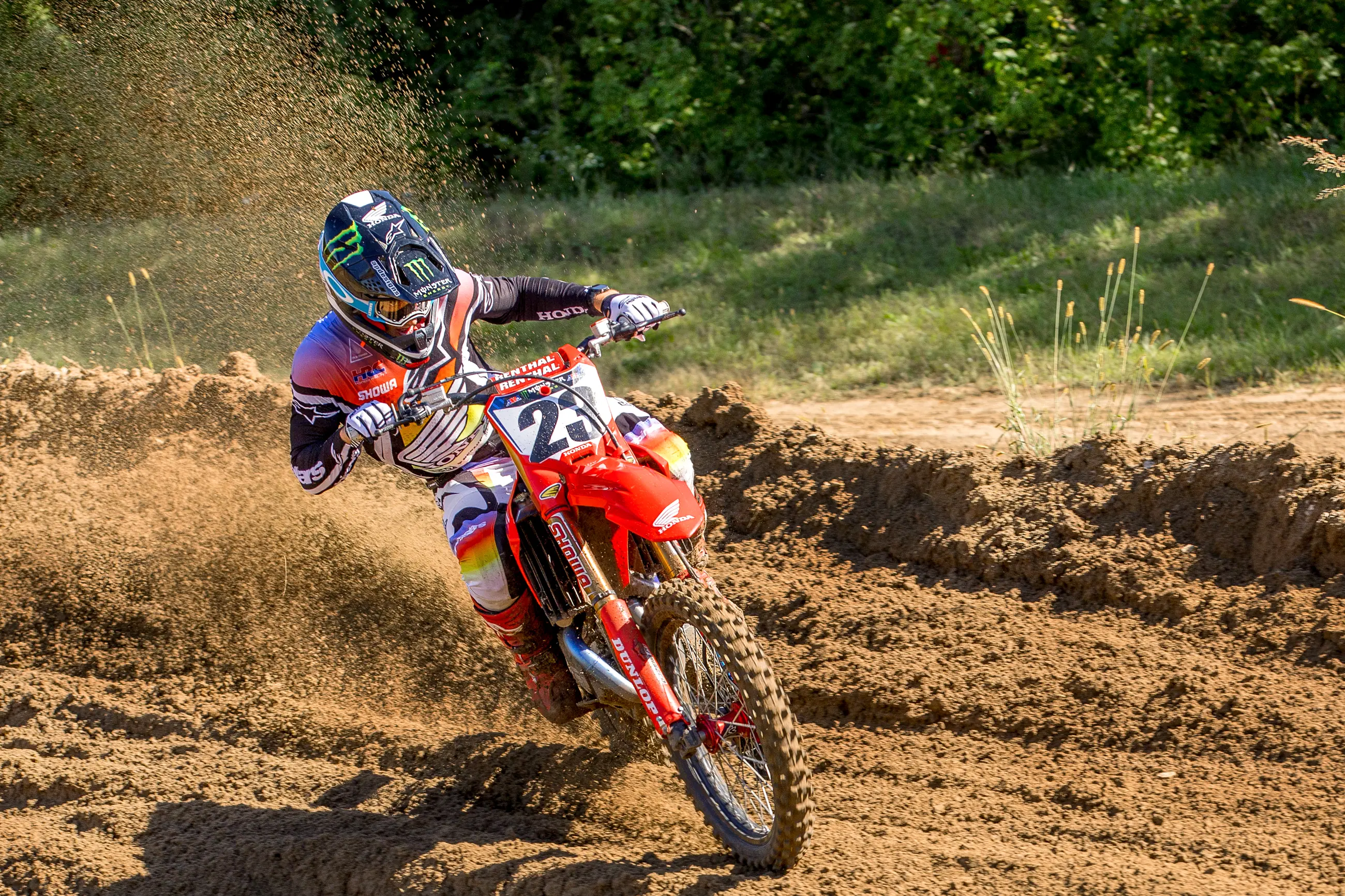 Professional motocross racer carving through a RedBud berm